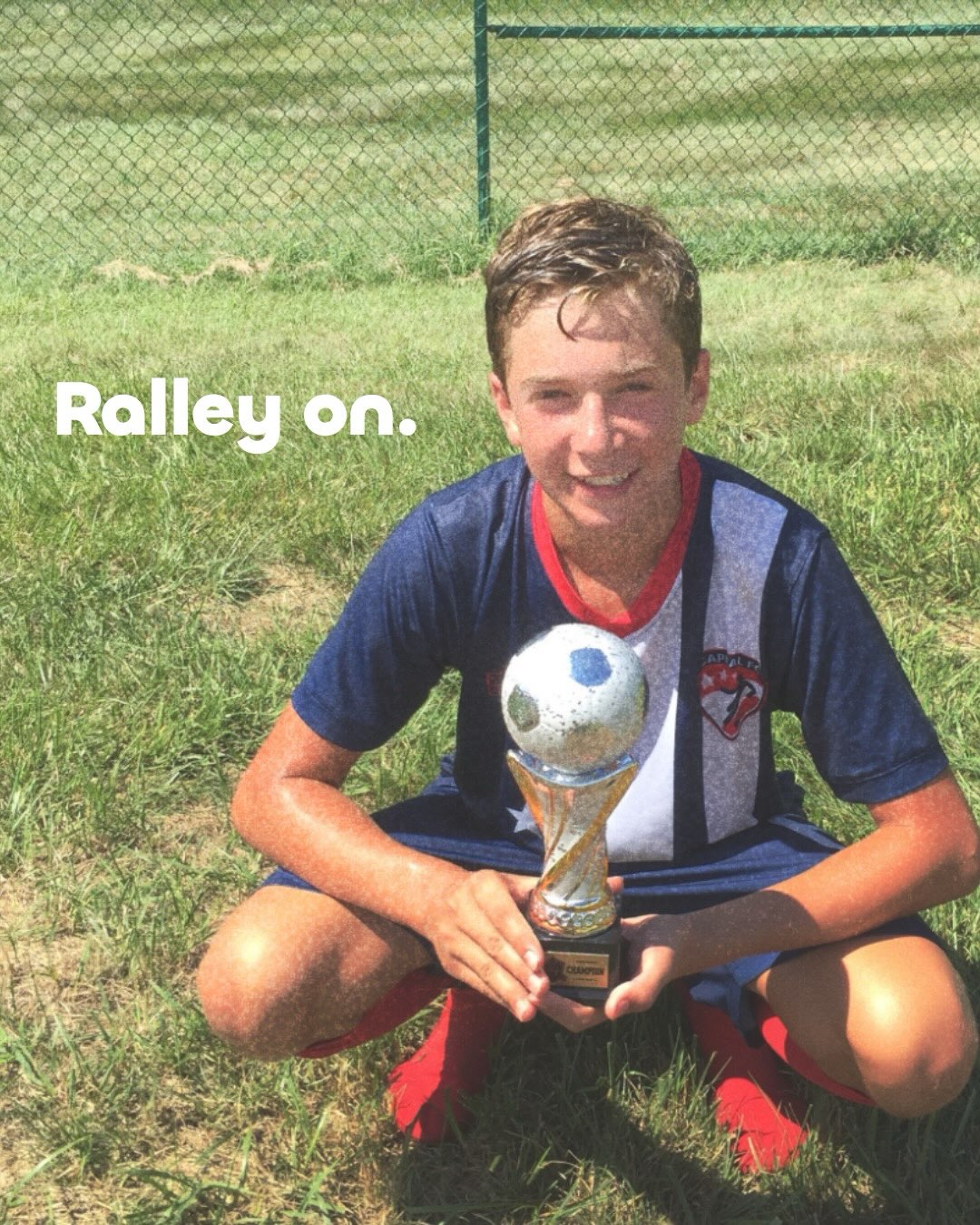 Young Kiko holding a soccer trophy. Ralley on.